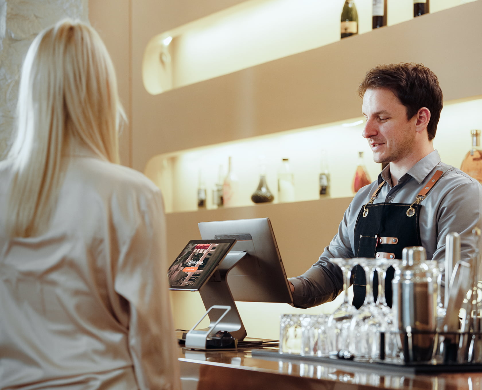 ID-check and checkout on the terminal at a bar counter