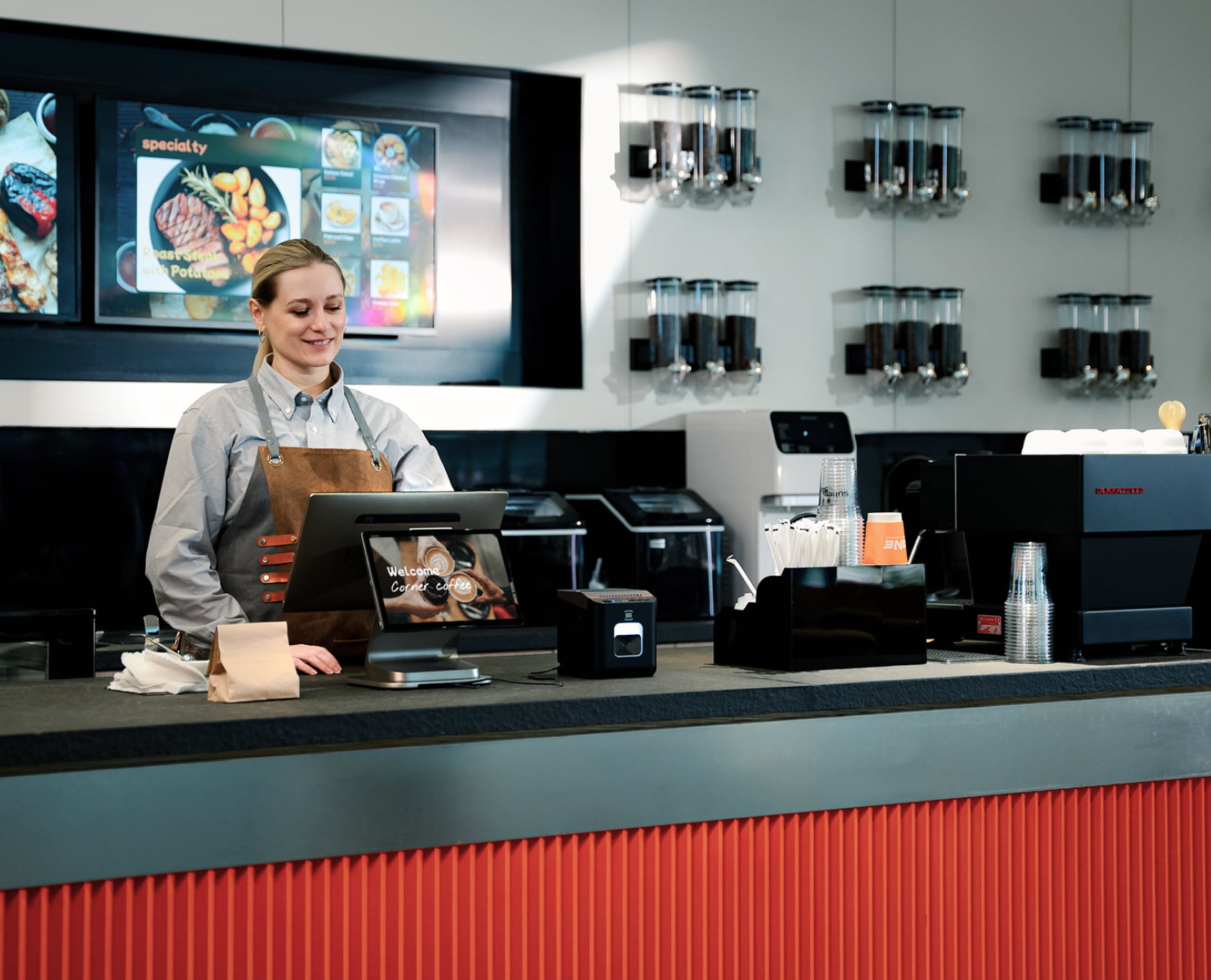 Barista ringing up an order on a PandazTech Terminal at a coffee counter